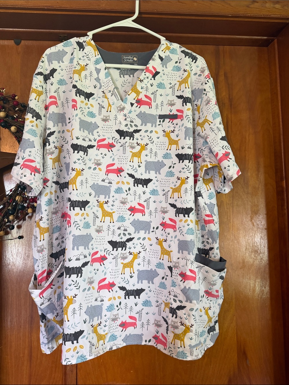 Sanibel scrub top in White with Multicolor Forest Animals